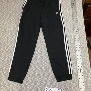 Adidas black sweatpants with white stripes and zipper pockets women L. SKU-A76
